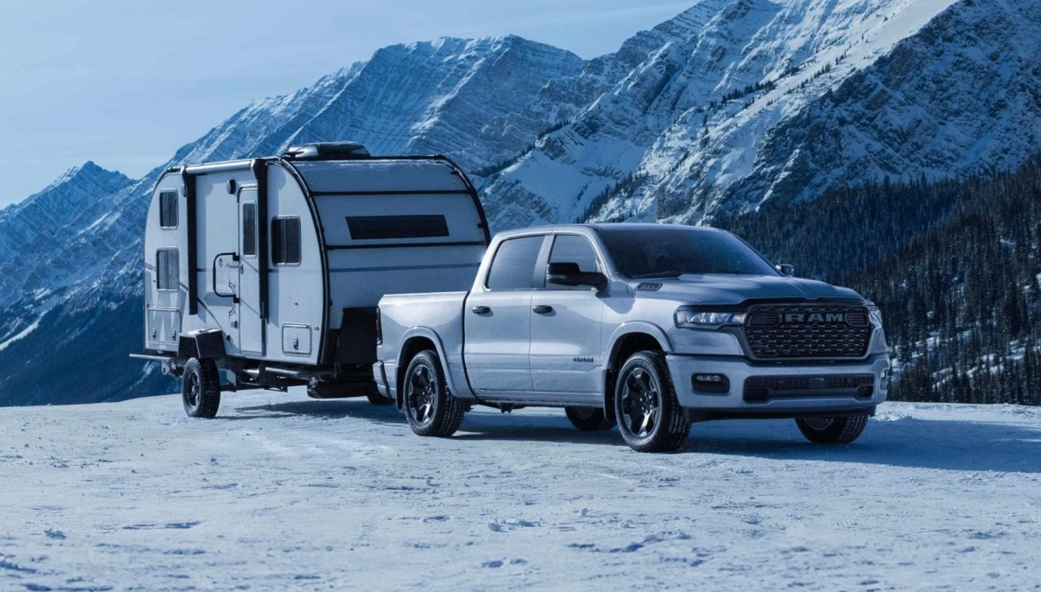 White 2026 Ram 1500 Big Horn 4x4 crew cab set up for towing and travel