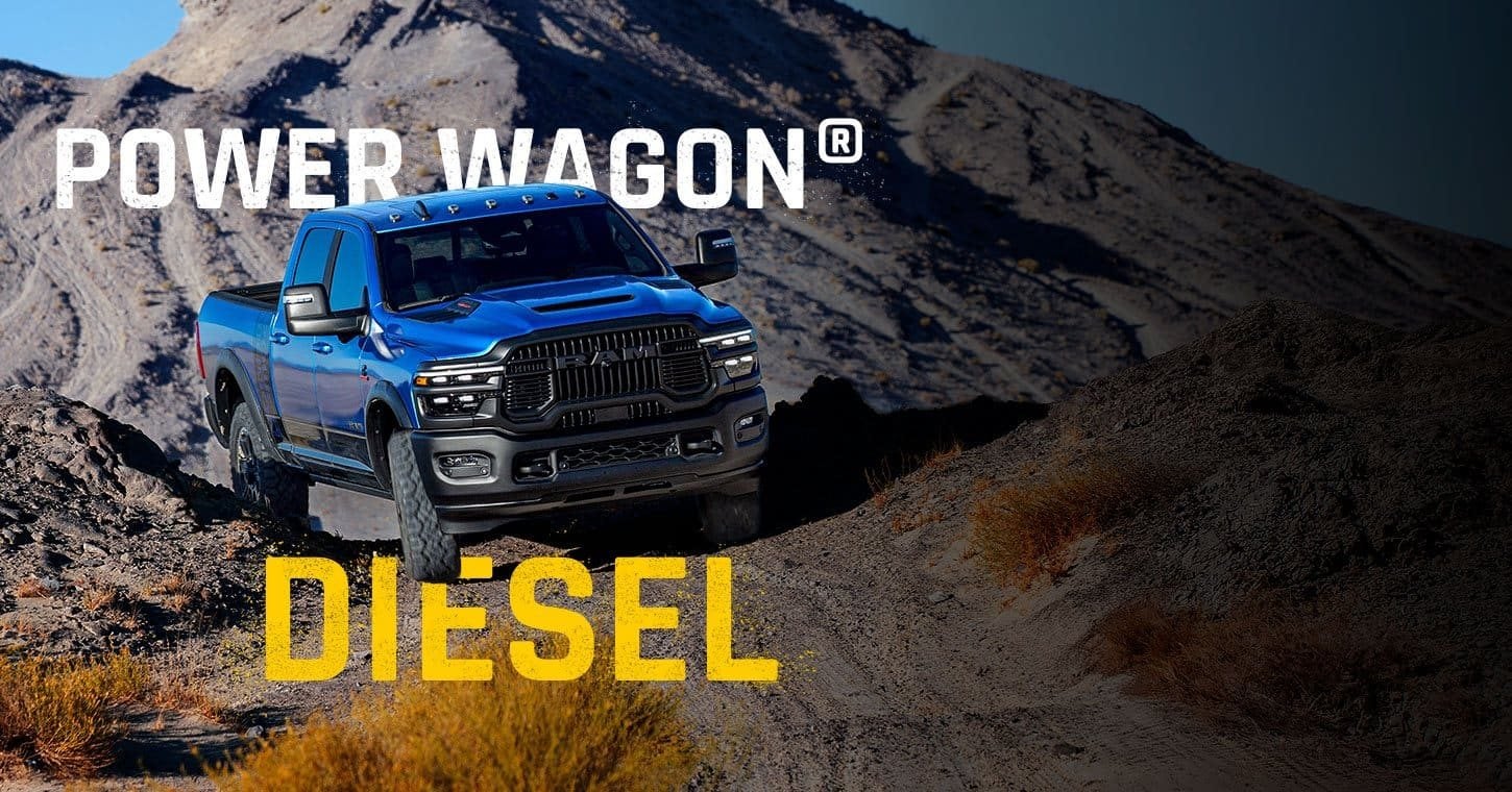 Blue 2026 Ram 2500 Power Wagon diesel pickup climbing rugged off road terrain